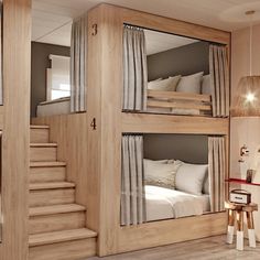 a room with bunk beds and stairs in it