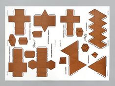 an origami cut out of brown paper with different shapes and sizes on it