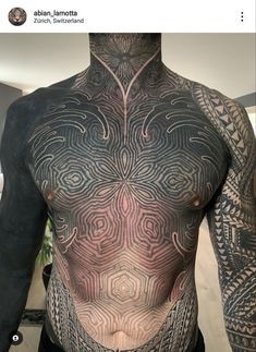 a man with tattoos on his back and chest