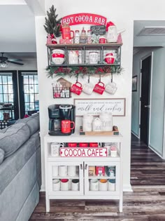 the coffee bar is decorated for christmas with red and white decorations on it's shelves