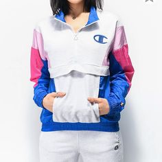 -Brand New With Tags Attached -Mixed Construction With Grey Sweatshirt-Style Chest And Multi-Colored Windbreaker Panels In Pink And Blue Throughout -Features Elastic Sleeve Cuffs And Bottom Hem, Kangaroo Pouch Pocket, Quarter Zip-Up Closure With Mock Neck, And Champion Logo At The Left Chest -83% Cotton, 17% Polyester Sporty Pink Sweatshirt With Pockets, Casual Pink Half-zip Outerwear, Pink Track Jacket With Pockets For Streetwear, Sporty Pink Track Jacket With Pockets, Color Block Long Sleeve Athleisure Outerwear, Casual Pink Track Jacket With Pockets, Sporty Pink Tops With Pockets, Sporty Pink Top With Pockets, Casual Pink Color Block Windbreaker