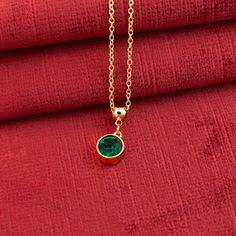 Make your friends green with envy wearing this exquisite 14K gold or silver plated crystal necklace. This minimalist and dainty piece, adorned with a radiant Bohemian Emerald green crystal, is the perfect embodiment of elegance and sophistication. Its unique adjustable sliding lobster clasp makes it an ideal fit for everyone, from little girls and teens with smaller necks to adults.  Here are some details you might appreciate: MATERIAL & COLOR: The pendant is crafted from 14K gold plated or silver plated metal, giving it high gloss and lustrous appearance  CHARM DESIGN: The Bohemian crystal is housed in solid bezel setting with an enclosed back to enhance the crystal's high reflection and shield it from dirt. Your charm also features our special ball connector with silicone insert which al Gold Dainty Crystal Necklaces For Party, Gold Dainty Crystal Necklace For Party, Elegant Green Round Charm Necklace, Elegant Green Round Charm Necklaces, Green Jewelry With Adjustable Chain For Anniversary, Green Adjustable Chain Jewelry For Anniversary, Green Necklace With Adjustable Chain For Anniversary, Elegant Green Charm Necklace For Anniversary, Elegant Green Crystal Necklace With Round Pendant