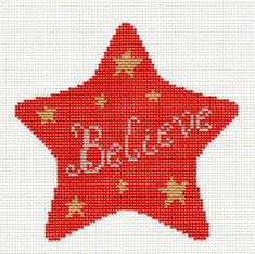 a red cross stitched star with the word believe on it