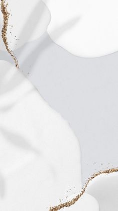 an abstract white background with gold glitters on the edges and in the foreground