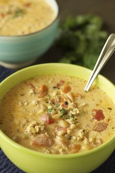 two bowls filled with soup on top of a table