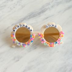 a pair of sunglasses with the words birthday girl on them