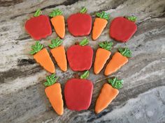 carrots and radishes are arranged in the shape of hearts on a marble surface