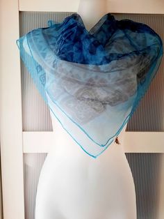 This a very beautiful vintage retro square organza scarf that was made by Alco, Japan. The scarf is dark teal blue color with a black geometric design. The scarf has a lovely sheen giving it a rich look. The scarf is in excellent/mint condition and will make a beautiful gift. The scarf can be used as a neck wrap, headband, head wrap, wrist band, bandana, etc. The scarf comes in a gift wrap and with a 'Thank you' card. For more scarves in my store visit: https://www.etsy.com/ca/shop/NostalgicByLi Vintage Blue Scarf One Size, Blue Vintage Shawl Scarf, Vintage Blue Scarves, Organza Scarf, Wrap Headband, Designer Scarf, Teal Blue Color, Headband Bandana, Head Wrap Headband