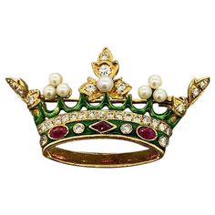 A chic and elegant brooch from the 1960’s depicting a royal crown. Studded with round brilliant cut diamonds, vivid red rubies, natural pearls and finished with hand painted green enamel, this brooch puts a royal touch on any outfit. Hand-fabricated in 18K yellow gold. Dimensions: 1.6 x 0.9 inches Elegant Brooch, Crown Brooch, Gold Fox, Ra Ideas, Expensive Jewelry Luxury, Gold Locket, Victorian Gold, Chic And Elegant, Expensive Jewelry