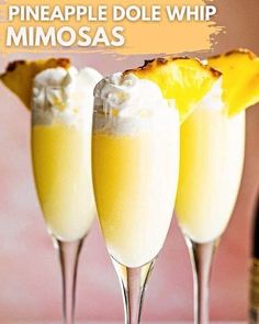 three champagne flutes filled with pineapple dole whip mimosas