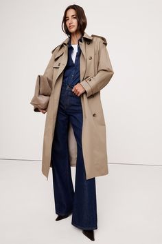 We cut this classic trench coat from a sturdy cotton twill thats specially treated to keep the elements out. This one is a little lighter than last years so you can layer it easily through seasons to come.Water-Resistant Warmer: Fully lined. Relaxed fit. Point collar with hidden button closure shoulder epaulettes and a belted waist with belt loops. Adjustable sleeve tabs. Two exterior and one interior pocket. Fully lined. 100% Cotton. Raining Boots, Timeless Fits, Camel Coat Outfit, Women's Trench Coat, Ralph Lauren Womens Clothing, Cotton Trench Coat, Shoulder Epaulettes, Tan Trench Coat, Trench Coat Outfit