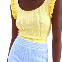 Nwt Zara Yellow Ruffled Cable Knit Top -Sleeveless Round Neck Top -Knit Woven Pattern On Front And Back -Crop Top With Ruffle Trim -Soft Feel Fabric -Materials: 99% Polyester, 1% Elastane -Size: Large -Color: Yellow -Measurements: **Please Also See Photos For Best Accuracy -Items Come From A Smoke Free And Pet Free (Unfortunately) Home -Please See My Other Matching Items For Combined Shipping And Savings !! Chic Sleeveless Cable Knit Top, Spring Chic Knitted Tank Top, Chic Knitted Tank Top For Spring, Chic Knitted Sweater Vest For Spring, Sleeveless Cable Knit Summer Tops, Yellow Sleeveless Sweater Vest For Spring, Sleeveless Pointelle Knit Top For Day Out, Sleeveless Cable Knit Tops For Summer, Spring Pointelle Knit Sweater Vest