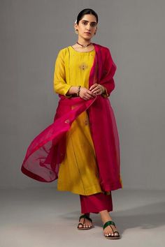 Yellow kurta with floral hand embroidery and contrast piping detailing. Paired with pant and dupatta.
Components: 3
Pattern: Embroidered
Type Of Work: Floral
Neckline: Round
Sleeve Type: Three quarter
Fabric: Kurta and Pant: Chanderi, Dupatta: Silk Organza
Color: Yellow
Other Details: 
Contrast hand embroidery
Attached lining
Length : 44 inches
Weight : 1 kg
Occasion: Wedding - Aza Fashions Semi-stitched Silk Kurta With Embroidered Border, Straight Tissue Silk Kurta With Embroidered Border, Tissue Silk Straight Kurta With Embroidered Border, Designer Silk Sharara With Embroidered Border, Unstitched Tissue Silk Sharara With Embroidered Border, Unstitched Embroidered Tissue Silk Sharara, Festive Unstitched Cotton Silk Suit With Embroidered Border, Chanderi Sets With Embroidered Border For Navratri, Semi-stitched Silk Dress With Embroidered Border