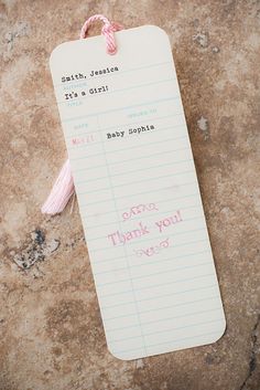 a baby thank note attached to a rock