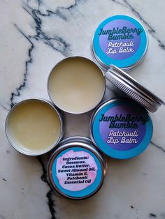 Treat your lips to this cocoa butter-based lip balm with a delicate scent of patchouli. All lip balms are 100% homemade, and contain beeswax, cocoa butter, sweet almond oil, vitamin E drops, and patchouli essential oil. No tints or colors added. Each tin contains 1 oz. of lip balm. Cocoa Butter Lip Balm, Lip Balm Ingredients, Patchouli Essential Oil, Saint Joseph, Lip Balms, Lip Balm Gloss, Sweet Almond Oil, Lip Care, Almond Oil