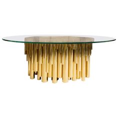 a glass table with gold rods on it