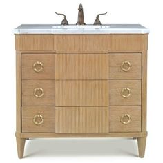 a bathroom vanity with two faucets on the top and one sink below it