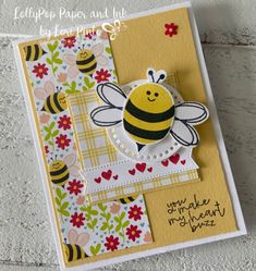 a close up of a card with a bee on it