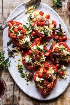 stuffed tomatoes with rice and herbs on a plate