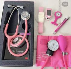 a pink stethoscope and other medical equipment