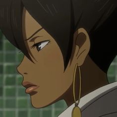 a close up of a person wearing earring's and looking off to the side