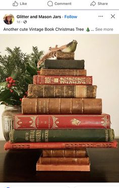 a stack of books sitting on top of a wooden table