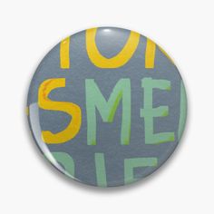 a button with the words 1011 sme on it