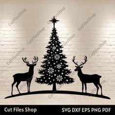 a christmas tree with two deers and a star on top is shown against a brick wall