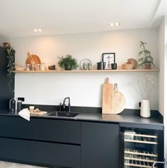 the kitchen is clean and ready to be used for wine tasting or as an appetizer