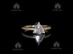 a pear shaped diamond ring with diamonds around it