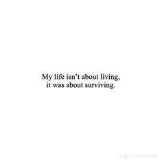 a white wall with the words, my life isn't about living it was about surviving