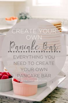 a pancake bar with raspberries and pancakes on the plate, in front of it