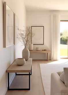 a living room filled with furniture and white walls