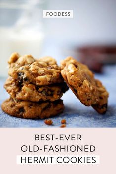 two cookies stacked on top of each other next to a glass of milk