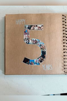 a spiral notebook with the number five on it and pictures of people in different years