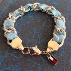 Tommy Hilfiger Polk-A-Dot Ribbon Link Chain In Silver Tone With Powder Blue Ribbon With Little White Polk-A-Dots. Has The Red, White And Blue Logo Charm. This Bracelet Was Never Worn. Sz 7.5 Inch. Beautiful For Spring/Summer. Blue Logo, Blue Ribbon, Powder Blue, Red White And Blue, Link Chain, Womens Jewelry Bracelets, Red White, Tommy Hilfiger, Silver Tone