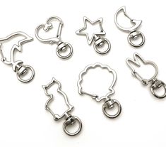 six metal clips with different shapes and sizes