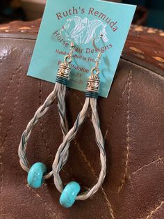 Hand-made horse hair loop earrings accented with turquoise dyed leather coed and turquoise beads. Braided loops are 2" long. Cowhide Hair Jewelry, Horse Hair Earrings, Resin Horse Hair, Horse Hair Necklace, Horse Hair Bracelet, Horse Hair Jewelry, Turquoise Leather, Loop Earrings, Horse Hair