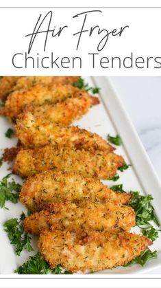 air fryer chicken tenders on a white plate with parsley sprigs