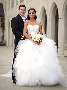 a bride and groom pose for a wedding photo