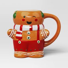 a ceramic mug shaped like a ginger holding a scarf