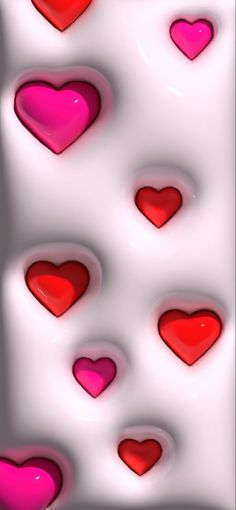 many red and pink hearts on a white background