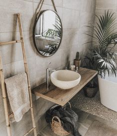 a bathroom with a sink, mirror and ladder