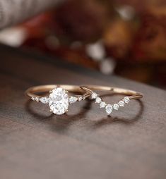 two gold wedding rings with diamonds on them