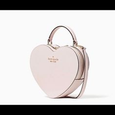 Brand New Love Shack Heart Purse From Kate Spade. Must Have In Your Collection. Details 7.48"H X 8.27"W X 2.36"D Handle Drop: 2.5" Strap Drop: 22" Saffiano Foil Embossed Logo Two Way Spade Jacquard Lining Interior Front Slip Pocket Zip Around Closure Style # Wkr00339 Kate Spade Heart Purse Pink, Kate Spade Heart Purse, Kate Spade Store, Light Pink Purse, New York Love, Kate Spade Heart, Foldover Crossbody Bag, Heart Purse, Dog Purse