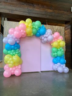 an arch made out of balloons on the floor