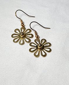 Dangle Earrings Gold Daisies are just over 1.25 inches long. These cute flowers were part of another piece of jewelry I disassembled. These simple yet elegant earrings are fun for everyday, especially in the spring or summer. Metal Flower Charm Earrings For Spring, Metal Flower-shaped Earrings For Spring, Metal Flower Charm Earrings, Flower-shaped Metal Earrings For Spring, Spring Flower-shaped Metal Earrings, Vintage Dangle Earrings For Spring, Vintage Metal Flower Earrings, Metal Flower Charm Drop Earrings, Metal Drop Earrings With Flower Charm