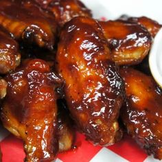 the chicken wings are covered in barbecue sauce