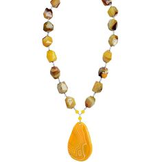 Stunning necklace for a fresh new look!get some wonderful earrings to wear with it EAER101217-01 or EAER022516-02 or EAER030216-03Due to inherent nature of natural stones, there may be slight variation in stone sizes, shapes, colors and patterns Stones: Agate yellow slice is color enhanced. Length: adjustable length is approx. 21" - 23". Width: center stone is approx. 3" long and 1 3/" wide. Neckline agate stones are approx. 3/4" x 3/4". Material: .925 Silver Made in: USA Luxury Orange Agate Necklace, Silver Statement Necklace, Yellow Agate, Silver Necklace Statement, Sunshine Yellow, Stone Pattern, Stunning Necklace, Agate Stone, Handmade Silver