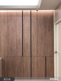 a bathroom with wooden cabinets and a skylight